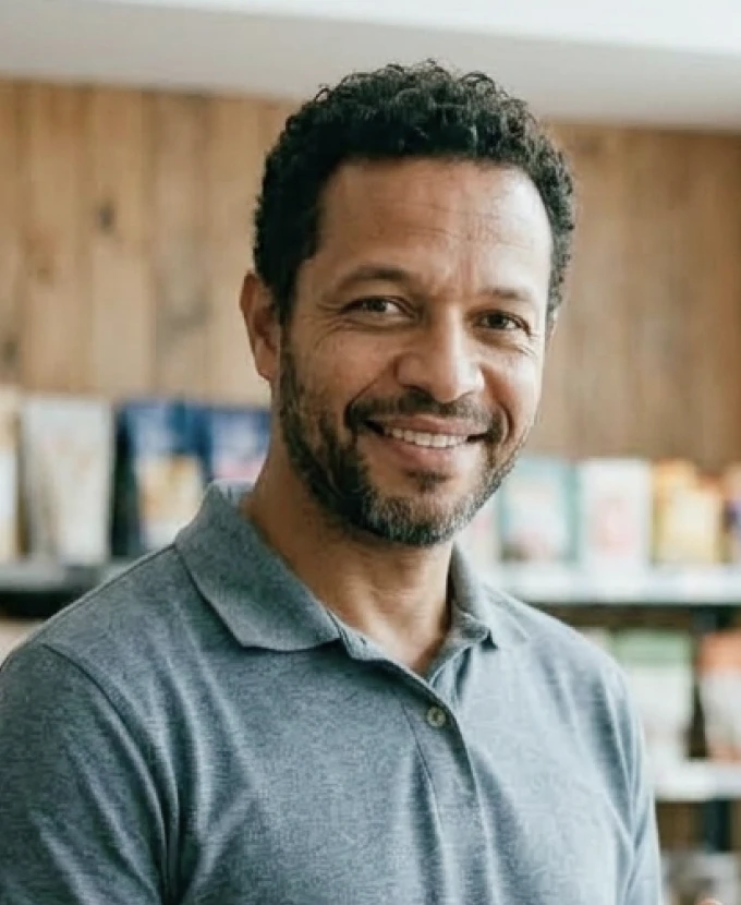 Store owner smiling in the sales area